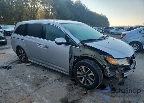 2014 Honda Odyssey Touring z USA, uszkodzony, nr VIN 5FNRL5H97EB038929